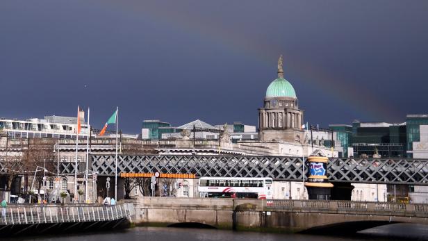 FILE PHOTO: A rainbow arches accross the sky behind Liberty Hall during the commemoration of the 100 year anniversary of the Irish Easter Rising in Dublin, Ireland, March 27, 2016. REUTERS/Clodagh Kilcoyne/File Photo