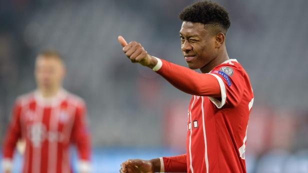 Bayern Munich&#039;s Austrian defender David Alaba gestures to supporters during the UEFA Champions League round of sixteen first leg football match Bayern Munich vs Besiktas Istanbul on February 20, 2018 in Munich, southern Germany. Bayern won 5-0. / AFP PHOTO / DPA / Matthias Balk / Germany OUT