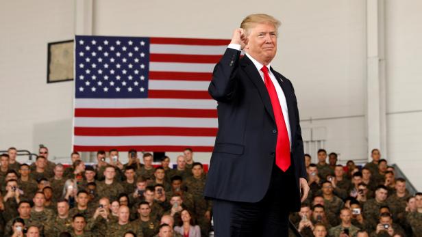 U.S. President Donald Trump pumps his fist after speaking at Marine Corps Air Station Miramar in San Diego, California