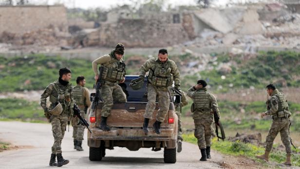 Turkish-backed Free Syrian Army fighters are seen in Maryamayn in eastern Afrin, Syria March 11, 2018. REUTERS/Khalil Ashawi