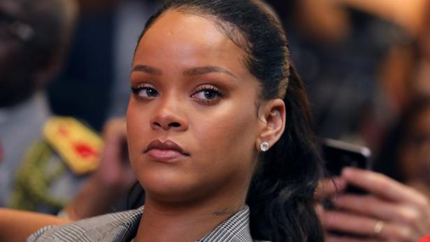 (FILES) In this file photo taken on February 2, 2018 Barbadian singer Rihanna attends the conference &quot;GPE Financing Conference, an Investment in the Future&quot; organised by the Global Partnership for Education in Dakar, as part of Macron&#039;s visit to Senegal. Rihanna on March 15, 2018 accused Snapchat of shaming domestic abuse victims after an advertisement made light of her beating by fellow pop star Chris Brown.The social media platform -- which counts 187 million users, especially young people drawn to its quickly vanishing posts -- had featured an advertisement for &quot;Would You Rather?,&quot; a game app that asks sometimes provocative questions. / AFP PHOTO / Ludovic MARIN