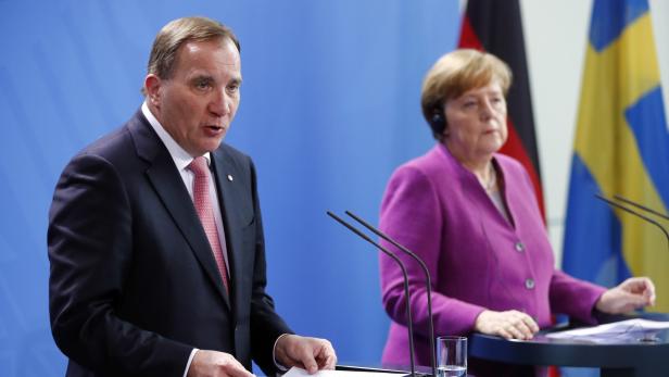 German Chancellor Angela Merkel and Swedish Prime Minister Stefan Lofven address a news conference after talks at the chancellery in Berlin, Germany, March 16, 2018. REUTERS/Hannibal Hanschke