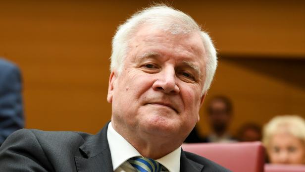 German Interior minister Horst Seehofer sits in Bavaria&#039;s State parliament (Landtag) where his successor as Bavarian State Premier is to be elected on March 16, 2018 in Munich. Horst Seehofer became German Interior minister in the Chancellor&#039;s new government and had declared that Islam is not &quot;part of Germany&quot; in an interview published on March 16, 2018, setting off a political storm two days into her fourth term. / AFP PHOTO / Christof STACHE