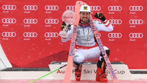 Overall Winner of the Men&#039;s Alpine Skiing World Cup Marcel Hirscher of Austria celebrates on the podium in Aare, Sweden, on March 18, 2018. / AFP PHOTO / Jonathan NACKSTRAND