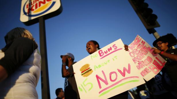 Workers protest outside McDonald's as part of a na