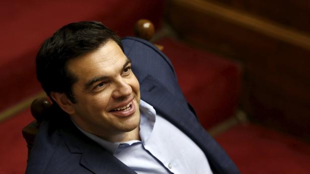 Greek PM Tsipras looks on during a parliamentary s