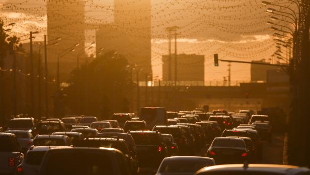 FILE PHOTO: Cars are stuck in traffic jam during sunset in Moscow