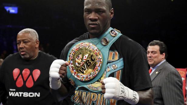 FILE PHOTO - Wilder celebrates after knocking out Artur Szpilka in the ninth round of their heavyweight title boxing fight at Barclays Center, in Brooklyn