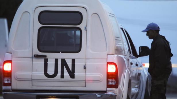 epa03613919 A soldier checks a vehicle entering the UN headquarters, the main camp of the Philippine UN peacekeeping troops, near Qunitra at the Israeli-Syrian border in the Golan Heights, 07 March 2013. Six of 21 UN peacekeepers abducted by rebels in Syria appeared to be safe and in good health in a video released 07 March 2013. The so-called Yarmouk Martyrs Brigade, a group of fighters linked to the rebel Free Syrian Army (FSA), claimed responsibility for taking 21 Filipino peacekeepers hostage. Part of the Philippines&#039; 300-member contingent on the Golan Heights, the peacekeepers were on a logistics run when their vehicles were blocked by about 30 Syrian rebels in the southern province of Daraa, said Colonel Arnulfo Burgos, a Philippine military spokesman. The rebels said the peacekeepers release was conditional on the withdrawal of government troops from the restive southern part of Syria. EPA/ATEF SAFADI