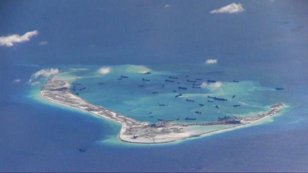 File Photo: Still image from United States Navy video purportedly shows Chinese dredging vessels in the waters around Mischief Reef in the disputed Spratly Islands