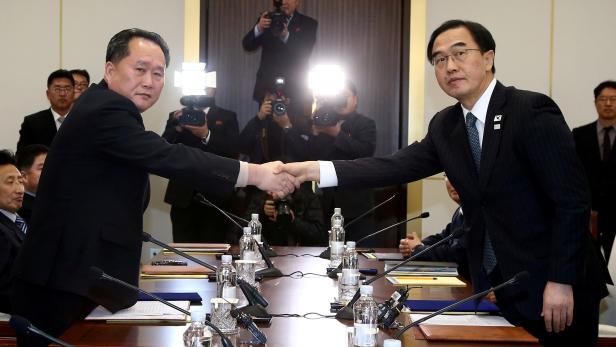 FILE PHOTO - South Korea's Unification Minister Cho Myoung-gyon shakes hands with Ri Son Gwon, chairman of North Korea's ÔCommittee for the Peaceful Reunification of the country' in Panmunjom
