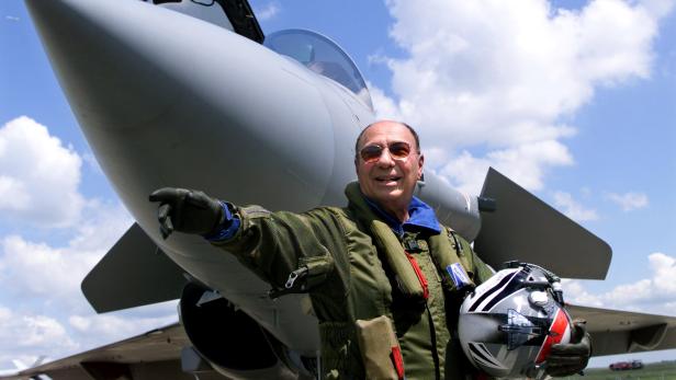 FILE PHOTO: Serge Dassault, head of Dassault Aviation, waves in front of a French made Rafale at Le Bourget