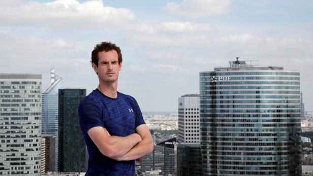 Andy Murray of Britain poses for a photo at a promotional event for the upcoming French Open tennis tournament at the financial and business district of La Defense, west of Paris