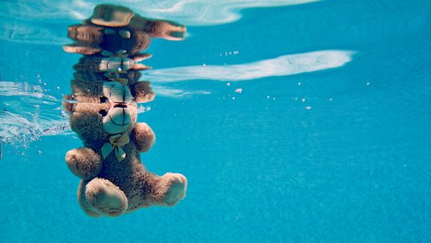 teddy bear drowning underwater