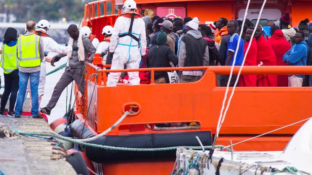 Migrants arrive aboard a Spanish maritime rescue boat after being rescued at sea south of Spain's Canary Islands at the port of Arguineguin on the island of Gran Canaria