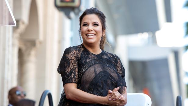 Eva Longoria reacts on the Hollywood Walk of Fame in Los Angeles