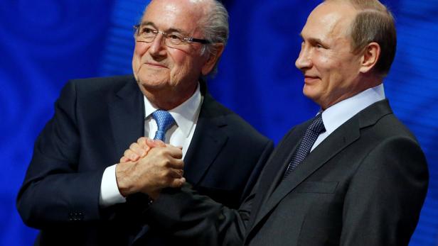 FILE PHOTO: FIFA's President Blatter shakes hands with Russia's President Putin during the preliminary draw for the 2018 FIFA World Cup at Konstantin Palace in St. Petersburg