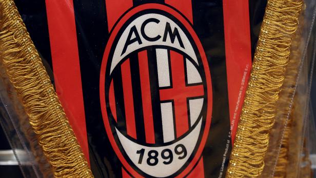 FILE PHOTO: The AC Milan logo is pictured on a pennant in a soccer store in downtown Milan