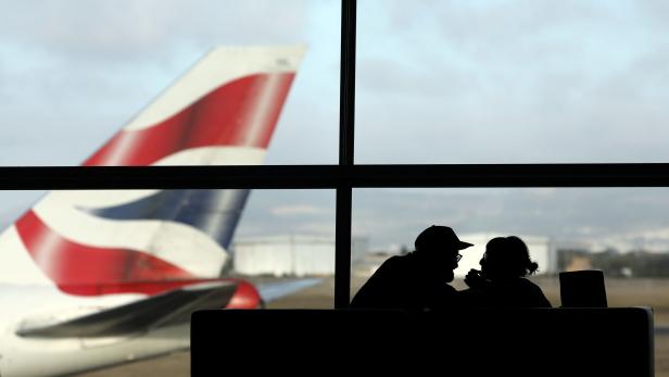 FILE PHOTO:FILE PHOTO:A British Airways Boeing 747 passenger aircraft prepares to take off as passengers wait to board a flight in Cape Town International airport in Cape Town