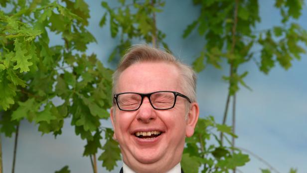 Britain's Environment Secretary Michael Gove reacts during a visit to the RHS Chelsea Flower Show in London, Britain