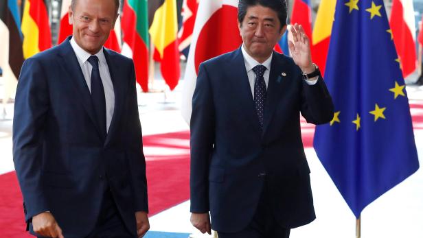 Japan's Prime Minister Shinzo Abe is welcomed by EU Council President Tusk at the start of a EU-JAPAN summit in Brussels