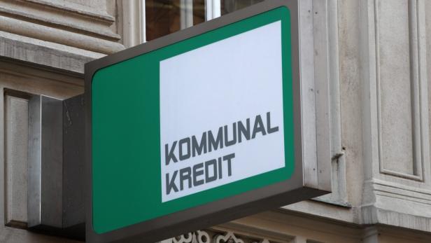 The logo of Kommunalkredit is pictured in front of its headquarters building in Vienna, March 5, 2012. Nationalised Austrian lender Kommunalkredit could need as much as one billion euros ($1.3 billion) as it tries to address its exposure to Greece, the country&#039;s finance minister told Austrian radio on Saturday. REUTERS/Heinz-Peter Bader (AUSTRIA - Tags: BUSINESS LOGO)
