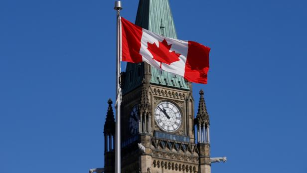 FILE PHOTO: Canadian flag flies in front of the Peace Tower on Parliament Hill in Ottawa