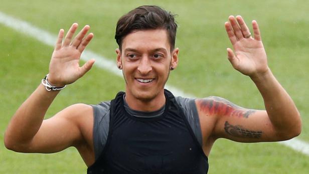 Arsenal's Mesut Ozil of Germany attends a training session in Singapore