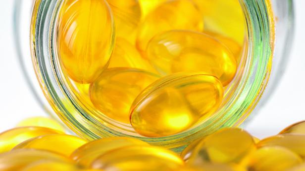 Fish oil and Evening Primrose capsules pills and container