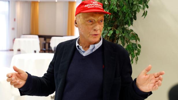 Former motor racing champion Niki Lauda talks to journalists during a meeting with Niki's employees at Vienna airport in Schwechat