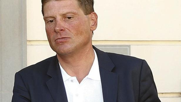 Television cameramen record as former German cyclist and Tour de France winner Jan Ullrich leaves after a trial in the regional court in Weinfelden