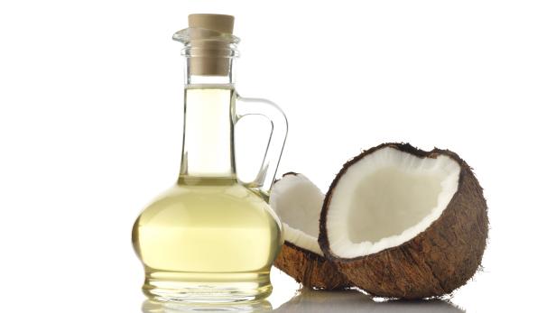 Coconut Oil with Coconuts on White Background