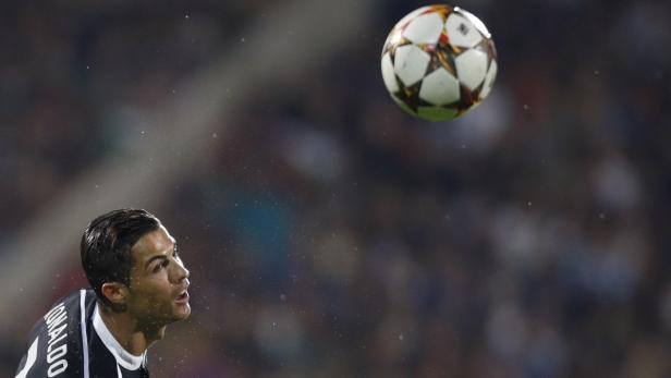 Ronaldo of Real Madrid heads the ball during their