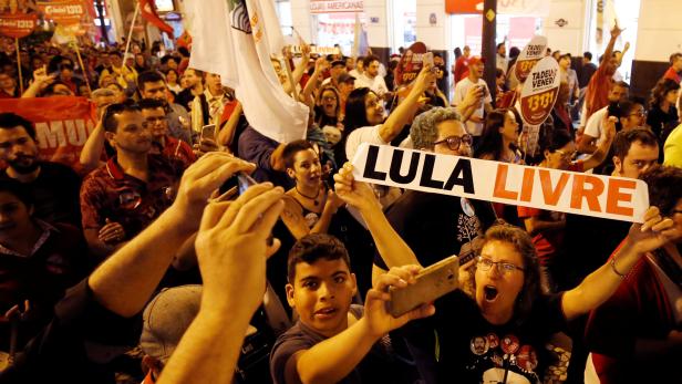 Supporters of the former Brazilian President Luiz Inacio Lula da Silva attend a rally in Curitiba
