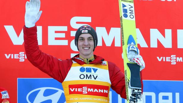 epa03636431 Gregor Schlierenzauer of Austria celebrates on the podium after winning the Ski Flying World Cup in Planica, Slovenia, 22 March 2013. EPA/ANTONIO BAT