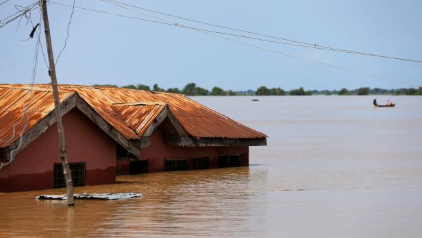 A house partially submerged in flood waters is pictured  in Lokoja city