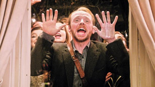 Simon Pegg als Shaun, umringt von Zombies in „Shaun of the Dead“.