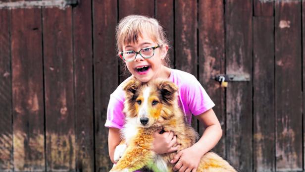 Ein Assistenz-Hund für ein Mädchen mit Down Syndrom