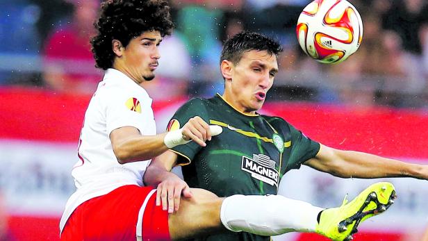 Salzburg's Ramalho challenges Celtic's Scepovic during their Europa League Group D soccer match in Salzburg 