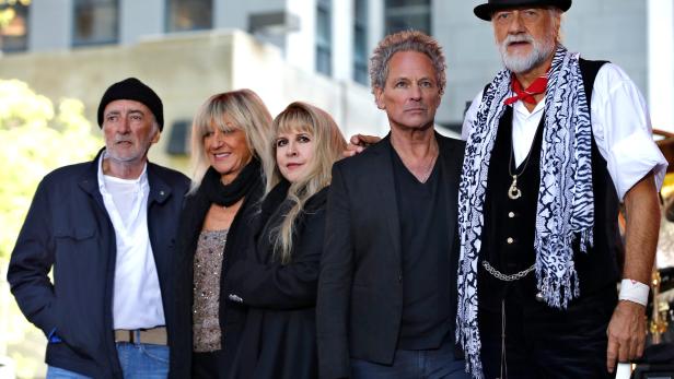 FILE PHOTO: Members of the rock band Fleetwood Mac stand together on stage after performing a concert on NBC's 'Today' show in New York City