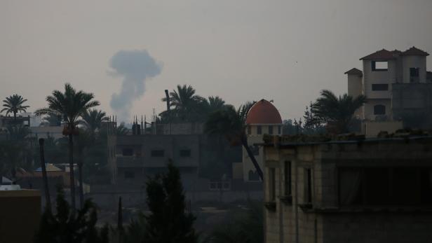 Smoke rises following an Israeli air strike in the southern Gaza Strip