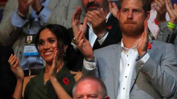 Britain's Prince Harry and Meghan, Duchess of Sussex, at the Invictus Games Sydney closing ceremony