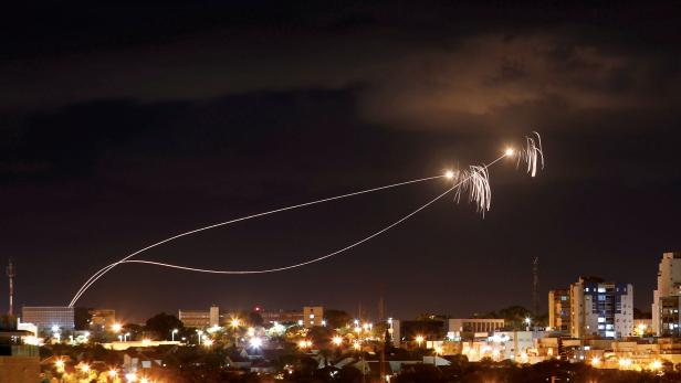 Iron Dome anti-missile system fires interception missiles as rockets are launched from Gaza towards Israel as seen from the city of Ashkelon, Israel