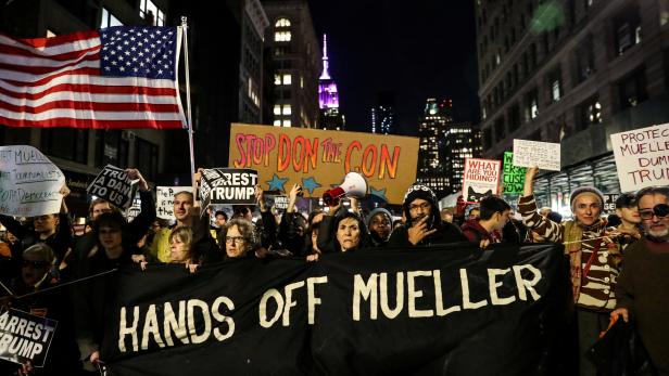 FILE PHOTO: People take part in a protest to protect the investigation led by Special Counsel Robert Mueller, in New York City
