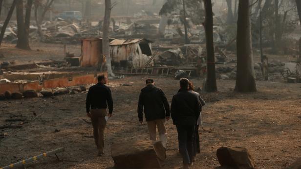 President Donald Trump visits the charred wreckage of Skyway Villa Mobile Home and RV Park with FEMA head Brock Long Paradise Mayor Jody Jones Governor-elect Gavin Newsom, and Governor Jerry Brown in Paradise California
