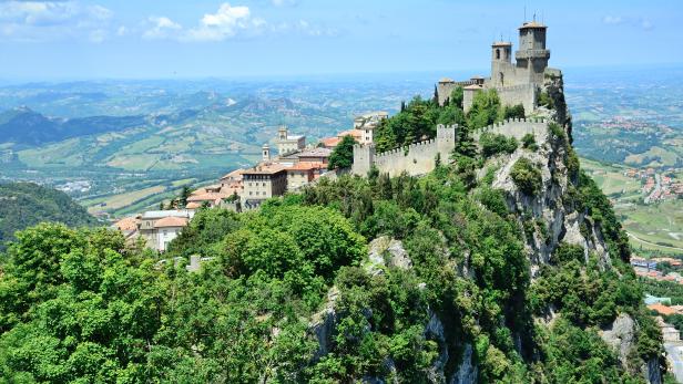 A castle covered in greenery in San Marino