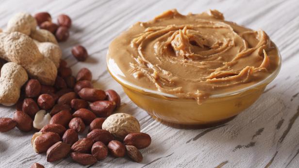 Tasty peanut butter in a bowl close up horizontal