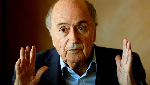 FILE PHOTO: Former FIFA President Blatter gestures during a round table talk with journalists in Zurich