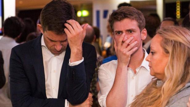 Supporters of the &#039;Stronger In&#039; Campaign react as results of the EU referendum are announced at a results party at the Royal Festival Hall in London on June 23, 2016. Bookmakers dramatically reversed the odds on Britain leaving the European Union on Friday as early results from a historic referendum pointed to strong support for a Brexit. / AFP PHOTO / POOL / ROB STOTHARD