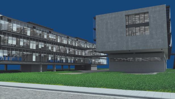 Ein modernes Bürogebäude mit großen Fensterfronten und einer Rasenfläche davor.